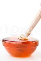 Honey dipper in a honey bowl