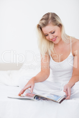 Blonde reading a magazine