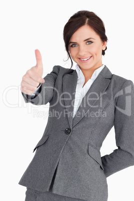 Beautiful young businesswoman the thumb-up