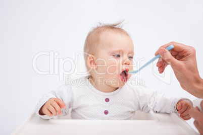 Baby being fed by her mother