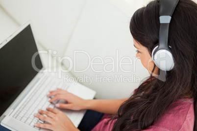 High-angle view of a student using her laptop