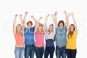A group of people with their hands raised