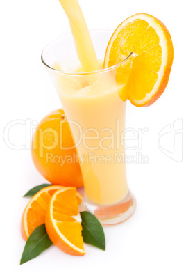 Orange juice splashing in a glass
