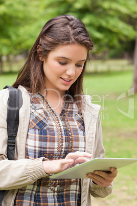 Close-up of a first-year student using a touch pad
