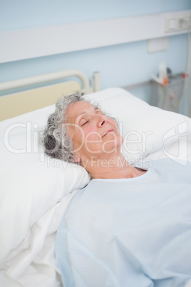 Patient sleeping on a bed