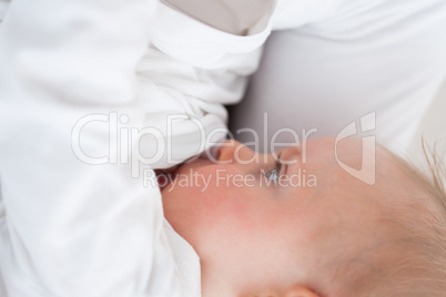 Cute baby being breastfed by her mother