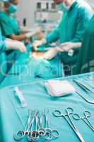 Focus on surgical tools next to operating table