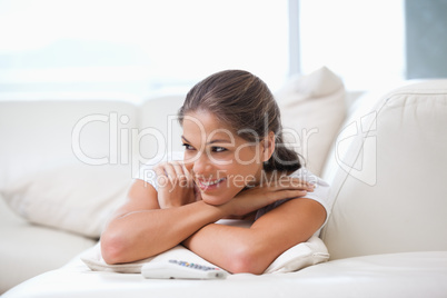 Women lying on a sofa while looking away