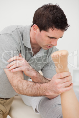 Doctor massaging a patient with his elbow