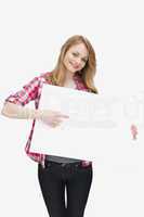Smiling woman showing a blank board