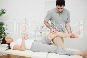 Peaceful brunette woman lying on a medical table