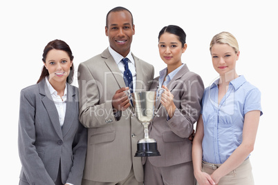 Close-up of a business team holding a cup