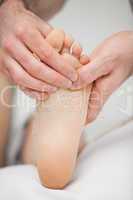 Foot being touched by a chiropodist