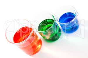 Three beakers of different colour and size