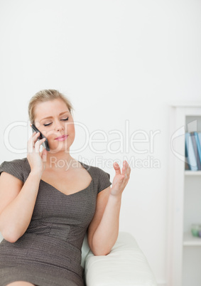 Woman calling while gesturing