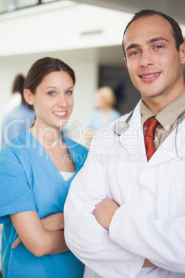 Doctor and nurse with arms crossed