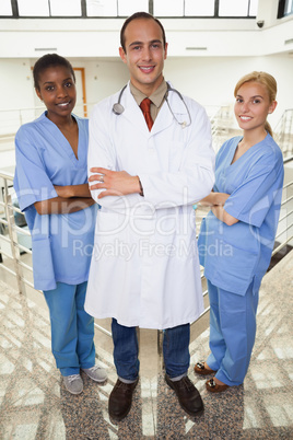 Doctor and nurses looking at camera