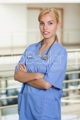 Blonde nurse with arms crossed