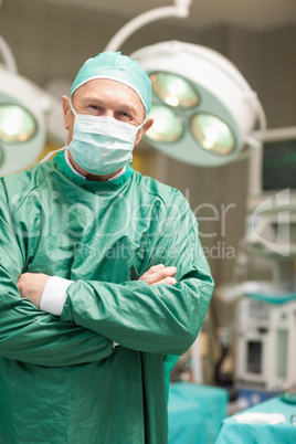Surgeon crossing his arms while standing