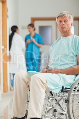 Patient in a wheelchair looking at camera