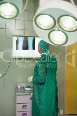 Surgeon looking at x-rays