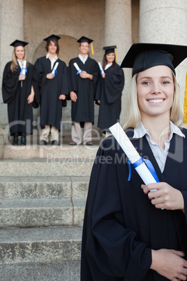 Close-up of a blonde graduate smiling