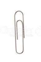 Close up of a grey paperclip on the floor