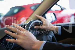 Man holding a steering wheel