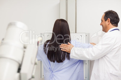 Doctor proceeding a mammography on a patient