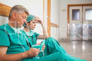 Serious surgeons waiting in the corridor