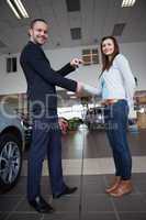 Man shaking hand with woman