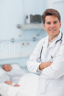 Doctor looking at camera with crossed arms
