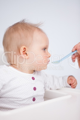 Cute baby eating her lunch