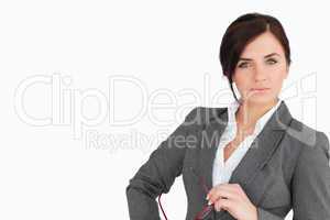 Attractive business woman holding glasses