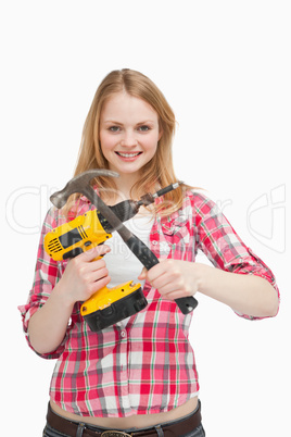 Young woman holding tools
