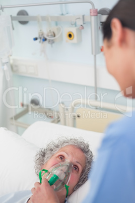 Patient having an oxygen mask on her face