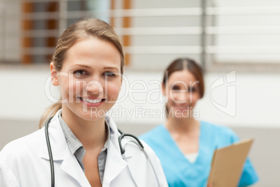 Doctor and and nurse standing