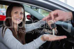 Happy client receiving car keys