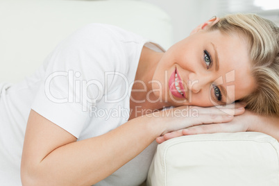 Woman resting on an armrest