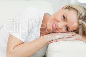 Woman resting on an armrest