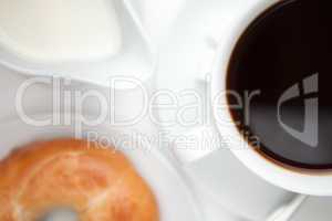 Black coffee with doughnut