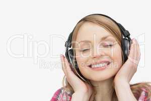 Woman smiling while listening music
