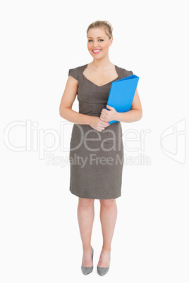 Woman holding a blue binder