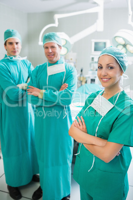 Surgical team standing up with arms crossed