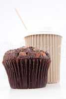 Chocolate muffin and a cup of coffee placed together