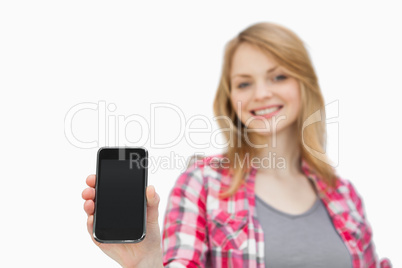 Woman showing a smartphone