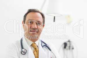 Doctor smiling with a stethoscope around his neck