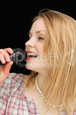 Blonde-haired woman singing