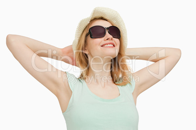 Woman wearing a summer hat while smiling