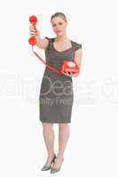 Woman holding a red phone